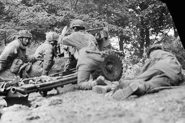 'Gallipoli II', a 6-pdr anti-tank gun of No. 26 Anti-Tank Platoon, 1st Border Regiment, 1st Airborne Division, in action in Oosterbeek, 20 September 1944. The gun was at this moment engaging a German PzKpfw B2 (f) Flammpanzer tank of Panzer-Kompanie 224 and successfully knocked it out. BU 1109 Part of WAR OFFICE SECOND WORLD WAR OFFICIAL COLLECTION No 5 Army Film & Photographic Unit Smith (Sgt)