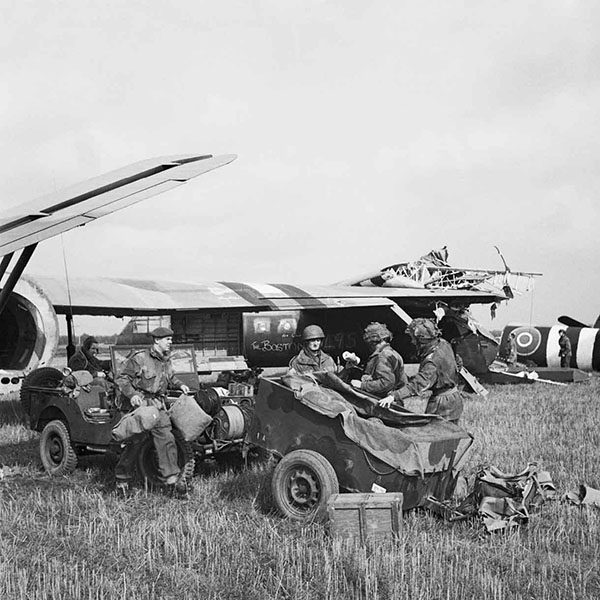 HQ of 1st Airlanding Light Regiment, Royal Artillery, unload a jeep and trailer from their Horsa glider at the landing zone near Wolfheze in Holland, 17 September 1944. Label HQ of 1st Airlanding Light Regiment, Royal Artillery, unload a jeep and trailer from their Horsa glider at the landing zone near Wolfheze in Holland, during Operation 'Market Garden', 17 September 1944. BU 1164 Part of WAR OFFICE SECOND WORLD WAR OFFICIAL COLLECTION Army Film and Photographic Unit Smith D M (Sgt)