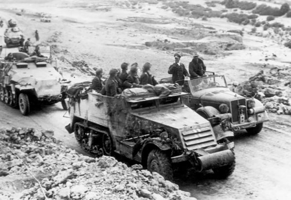 Rommel addresses his troops riding in a captured US M3 half-track. 