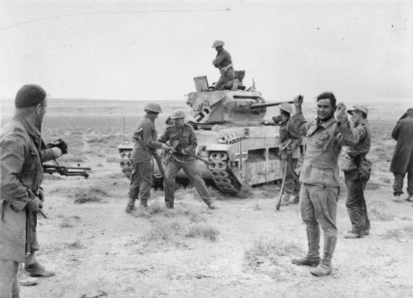 New Zealanders of the 2nd Infantry Division recapture a Matilda tank, taking the German crew prisoner in the process. 