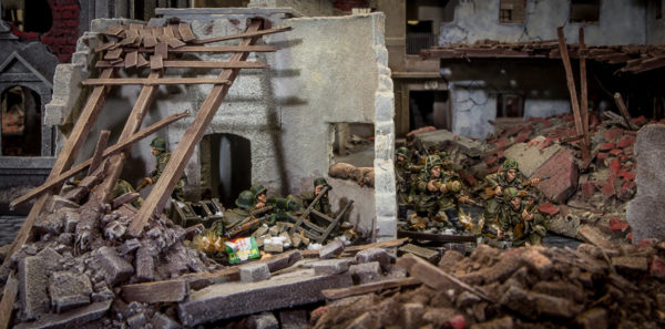 Hungarian soldiers dig in among huge piles of rubble.
