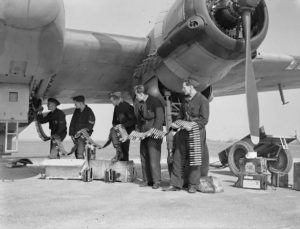 Ground crew load 20mm cannon shells into a Beaufighter MkVI Night Fighter. 